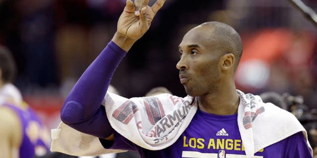 Los Angeles Lakers' Kobe Bryant acknowledges the fans as he leaves the court after an NBA basketball game against the Houston Rockets Saturday, Dec. 12, 2015, in Houston. The Rockets won 126-97. (AP Photo/Pat Sullivan)