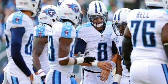 Dec 13, 2015; East Rutherford, NJ, USA; Tennessee Titans quarterback Marcus Mariota (8) in the huddle against the New York Jets during the first quarter at MetLife Stadium. Mandatory Credit: Brad Penner-USA TODAY Sports