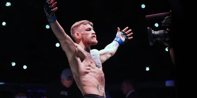 LAS VEGAS, NEVADA - DECEMBER 12: Conor McGregor of Ireland is introduced to the crowd before facing Jose Aldo of Brazil in their featherweight championship bout during the UFC 194 event inside MGM Grand Garden Arena on December 12, 2015 in Las Vegas, Nevada. (Photo by Jeff Bottari/Zuffa LLC/Zuffa LLC via Getty Images)