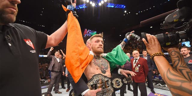 LAS VEGAS, NV - DECEMBER 12: Conor McGregor of Ireland reacts to his victory over Jose Aldo of Brazil in their UFC featherweight championship bout during the UFC 194 event inside MGM Grand Garden Arena on December 12, 2015 in Las Vegas, Nevada. (Photo by Josh Hedges/Zuffa LLC/Zuffa LLC via Getty Images)