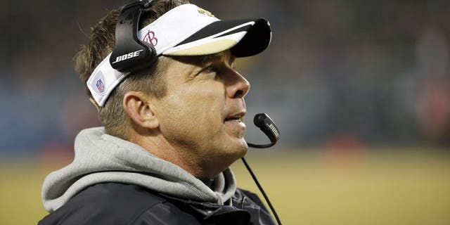 New Orleans Saints head coach Sean Payton watches from the sideline during the first half of an NFL football game against the Chicago Bears Monday, Dec. 15, 2014, in Chicago. (AP Photo/Charles Rex Arbogast)