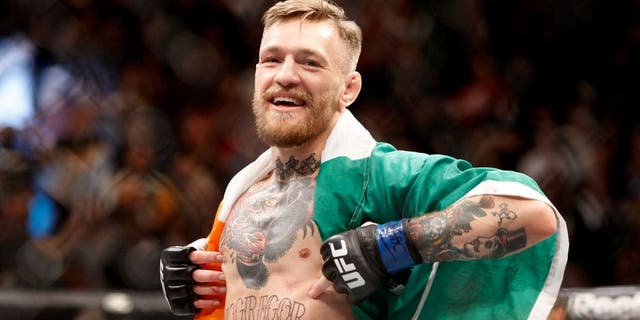 LAS VEGAS, NV - DECEMBER 12: Conor McGregor celebrates after a first-round knockout victory over Jose Aldo in their featherweight title fight during UFC 194 on December 12, 2015 in Las Vegas, Nevada. (Photo by Steve Marcus/Getty Images)