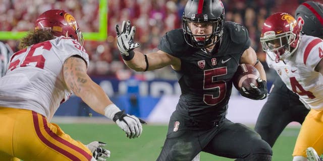 SANTA CLARA, CA - DECEMBER 5: Christian McCaffrey #5 of the Stanford Cardinal runs with the ball during the Pac-12 Championship Game against the USC Trojans played on December 5, 2015 at Levi's Stadium in Santa Clara, California. Visible at left is Anthony Sarao #56 of USC. (Photo by David Madison/Getty Images)
