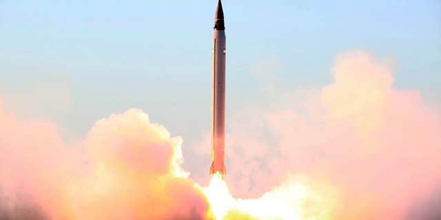 FILE - This file picture released by the official website of the Iranian Defense Ministry on Sunday, Oct. 11, 2015, claims to show the launching of an Emad long-range ballistic surface-to-surface missile in an undisclosed location.