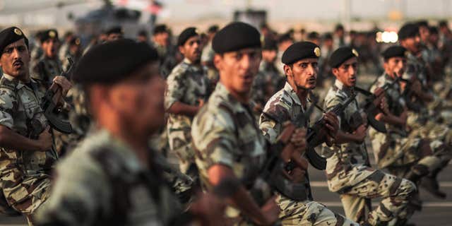FILE - In this Thursday, Sept. 17, 2015 file photo, Saudi security forces take part in a military parade in preparation for the annual Hajj pilgrimage in Mecca, Saudi Arabia.