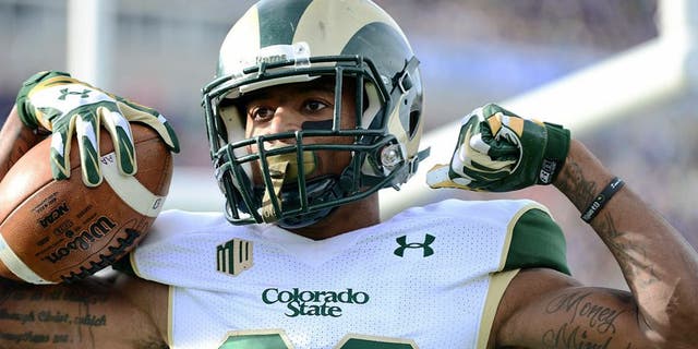 Nov 28, 2014; Colorado Springs, CO, USA; Colorado State Rams wide receiver Rashard Higgins (82) celebrates his touchdown reception in the first quarter against the Air Force Falcons at Falcon Stadium. Mandatory Credit: Ron Chenoy-USA TODAY Sports
