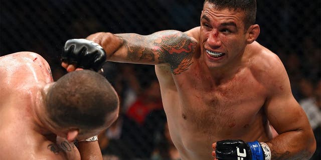 MEXICO CITY, MEXICO - JUNE 13: (R-L) Fabricio Werdum punches Cain Velasquez in their UFC heavyweight championship bout during the UFC 188 event inside the Arena Ciudad de Mexico on June 13, 2015 in Mexico City, Mexico. (Photo by Josh Hedges/Zuffa LLC/Zuffa LLC via Getty Images)