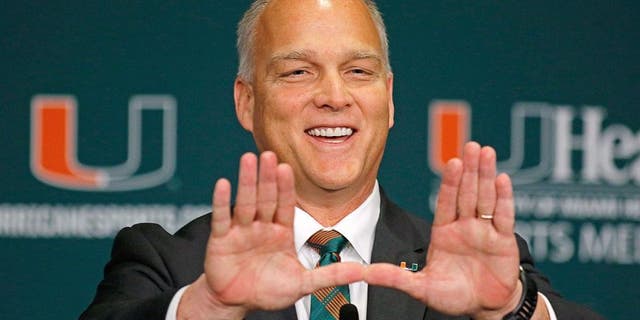 CORAL GABLES, FL - DECEMBER 04: New University of Miami Hurricanes head coach Mark Richt makes the 'U' sign after he was introduced at a press conference at the school on December 4, 2015 in Coral Gables, Florida. (Photo by Joe Skipper/Getty Images)