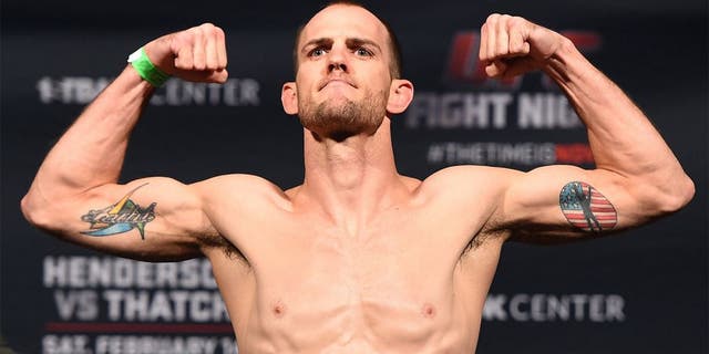 BROOMFIELD, CO - FEBRUARY 13: Cole Miller weighs in during the UFC weigh-in at the 1stBank Center on February 13, 2015 in Broomfield, Colorado. (Photo by Josh Hedges/Zuffa LLC/Zuffa LLC via Getty Images)