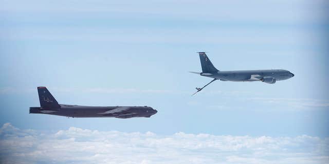June 17, 2014: A U.S. Air Force B-52 is seen through the window of another as it prepares for a mid-air refuel during a training mission in the United Kingdom's airspace.
