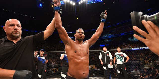 ORLANDO, FL - DECEMBER 19: Alistair Overeem celebrates his TKO victory over Junior dos Santos in their heavyweight bout during the UFC Fight Night event at the Amway Center on December 19, 2015 in Orlando, Florida. (Photo by Josh Hedges/Zuffa LLC/Zuffa LLC via Getty Images)
