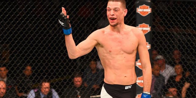 ORLANDO, FL - DECEMBER 19: Nate Diaz taunts Michael Johnson in their lightweight bout during the UFC Fight Night event at the Amway Center on December 19, 2015 in Orlando, Florida. (Photo by Josh Hedges/Zuffa LLC/Zuffa LLC via Getty Images)