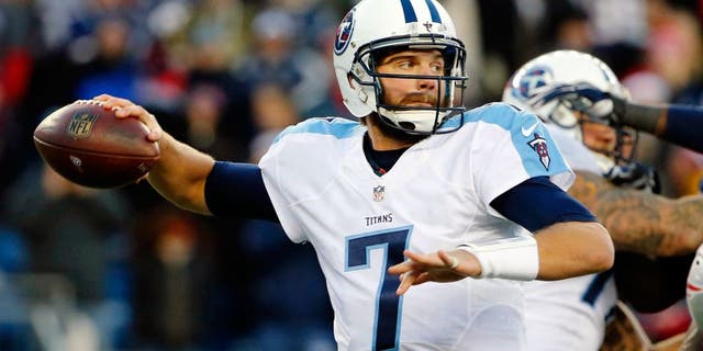 Dec 20, 2015; Foxborough, MA, USA; Tennessee Titans quarterback Zach Mettenberger (7) throws under pressure during the second half of the New England Patriots 33-16 win over the Tennessee Titans at Gillette Stadium. Mandatory Credit: Winslow Townson-USA TODAY Sports