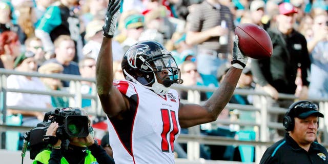 Dec 20, 2015; Jacksonville, FL, USA; Atlanta Falcons wide receiver Julio Jones (11) reacts after scoring a touchdown against the Jacksonville Jaguars during the first half at EverBank Field. Mandatory Credit: Kim Klement-USA TODAY Sports