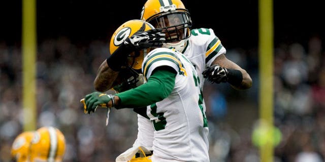 Dec 20, 2015; Oakland, CA, USA; Green Bay Packers free safety Ha Ha Clinton-Dix (21) celebrates with cornerback Damarious Randall (23) after Randall intercepted the ball and ran for a touchdown against the Oakland Raiders during the first quarter at O.co Coliseum. Mandatory Credit: Kelley L Cox-USA TODAY Sports