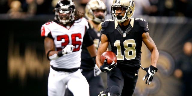 Dec 21, 2014; New Orleans, LA, USA; New Orleans Saints wide receiver Jalen Saunders (18) returns the opening kickoff as Atlanta Falcons strong safety Kemal Ishmael (36) chases during the first quarter at the Mercedes-Benz Superdome. Mandatory Credit: Derick E. Hingle-USA TODAY Sports