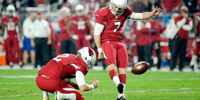 Dec 21, 2014; Glendale, AZ, USA; Arizona Cardinals kicker Chandler Catanzaro (7) kicks a field goal against the Seattle Seahawks during the first half at University of Phoenix Stadium. Mandatory Credit: Joe Camporeale-USA TODAY Sports