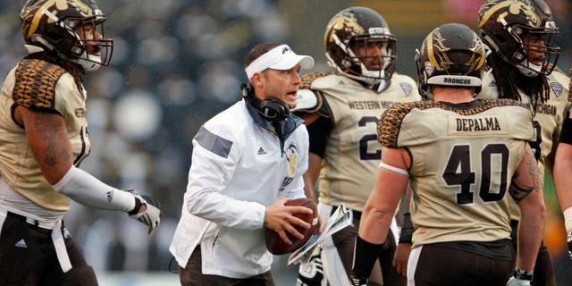 Nov 27, 2015; Toledo, OH, USA; Western Michigan Broncos head coach P.J. Fleck talks to players during the fourth quarter against the Toledo Rockets at Glass Bowl. Broncos win 35-30. Mandatory Credit: Raj Mehta-USA TODAY Sports