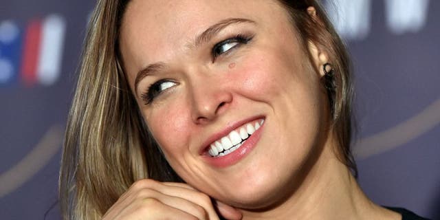 Ronda Rousey of the US talks to the press before a face-off for the UFC fight in Melbourne on November 13, 2015. Over 55,000 are expected to attend the UFC fight between Rousey and compatriot Holly Holm in Melbourne on November 15. RESTRICTED TO EDITORIAL USE NO ADVERTISING USE NO PROMOTIONAL USE NO MERCHANDISING USE AFP PHOTO/Paul CROCK (Photo credit should read PAUL CROCK/AFP/Getty Images)