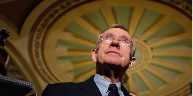 Dec. 24: Senate Majority Leader Harry Reid listens to questions following the passage of the Senate health care bill.