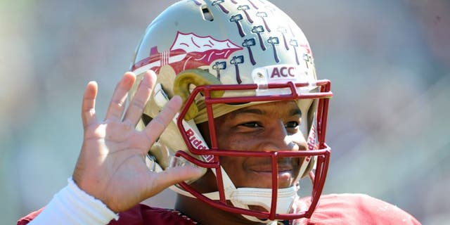 Oct 26, 2013; Tallahassee, FL, USA; Florida State Seminoles quarterback Jameis Winston (5) warms up before the start of the game against the North Carolina State Wolfpack at Doak Campbell Stadium. Mandatory Credit: Melina Vastola-USA TODAY Sports