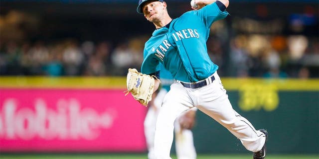 Aug 21, 2015; Seattle, WA, USA; Seattle Mariners pitcher Rob Rasmussen (50) throws the ball against the Chicago White Sox during the eighth inning at Safeco Field. Mandatory Credit: Joe Nicholson-USA TODAY Sports