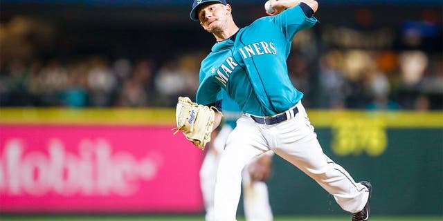 Aug 21, 2015; Seattle, WA, USA; Seattle Mariners pitcher Rob Rasmussen (50) throws the ball against the Chicago White Sox during the eighth inning at Safeco Field. Mandatory Credit: Joe Nicholson-USA TODAY Sports