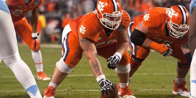 Dec 5, 2015; Charlotte, NC, USA; Clemson Tigers center Jay Guillermo (57) prepares to snap the ball during the second half against the North Carolina Tar Heels in the ACC football championship game at Bank of America Stadium. Clemson defeated North Carolina 45-37. Mandatory Credit: Jeremy Brevard-USA TODAY Sports
