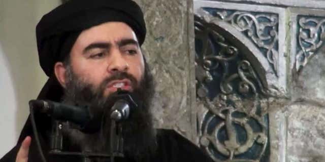 FILE - This file image made from video posted on a militant website Saturday, July 5, 2014, purports to show the leader of the Islamic State group, Abu Bakr al-Baghdadi, delivering a sermon at a mosque in Iraq during his first public appearance.