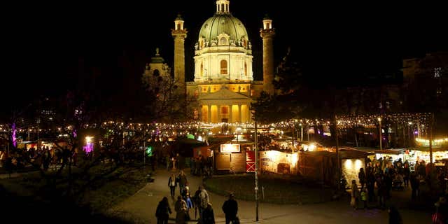 Dec. 22, 2015: A view of "Christkindlmarkt" Advent market in front of Karlskirche church in Vienna, Austria