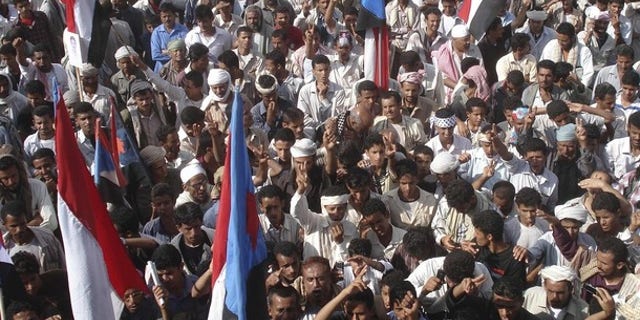 Dec. 17: Protesters wave flags of former South Yemen as they shout slogans during anti-government rallies organized by the Southern Movement to demand southern Yemen secede from the northern half (Reuters).