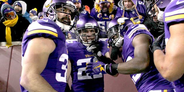 MINNEAPOLIS, MN - DECEMBER 27: Harrison Smith #22 of the Minnesota Vikings and teammates celebrate Smith's interception for a touchdown in the second quarter against the New York Giants on December 27, 2015 at TCF Bank Stadium in Minneapolis, Minnesota. (Photo by Adam Bettcher/Getty Images)