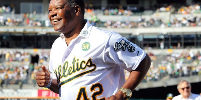 OAKLAND, CA - JULY 19: Dave Henderson #42 of the 1989 Oakland A's joins his teammates as they celebrate their World Series championship 25 years ago against the San Francisco Giants before a game at O.co Coliseum on July 19, 2014 in Oakland, California. (Photo by Brian Bahr/Getty Images)