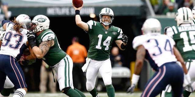 EAST RUTHERFORD, NJ - DECEMBER 27: Ryan Fitzpatrick #14 of the New York Jets throws a pass in the first quarter against the New England Patriots during their game at MetLife Stadium on December 27, 2015 in East Rutherford, New Jersey. (Photo by Jeff Zelevansky/Getty Images)
