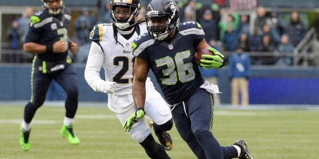 Dec 27, 2015; Seattle, WA, USA; Seattle Seahawks running back Bryce Brown (36) is defended by St. Louis Rams cornerback Trumaine Johnson (22) during an NFL football game at CenturyLink Field. Mandatory Credit: Kirby Lee-USA TODAY Sports
