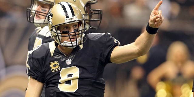 Dec 27, 2015; New Orleans, LA, USA; New Orleans Saints quarterback Drew Brees (9) gestures during the first quarter of their game against the Jacksonville Jaguars at the Mercedes-Benz Superdome. Mandatory Credit: Chuck Cook-USA TODAY Sports