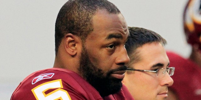 FILE: Then-Washington Redskins quarterback Donovan McNabb stands on the sidelines before an NFL football game against the Dallas Cowboys in Arlington, Texas.