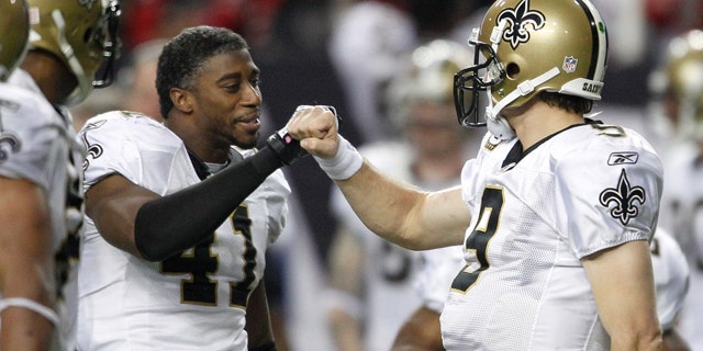 New Orleans Saints quarterback Drew Brees, right, celebrates with Roman Harper (41) in the final seconds of an NFL football game against the Atlanta Falcons on Monday, Dec. 27, 2010, in Atlanta. New Orleans won 17-14. (AP Photo/David Goldman)