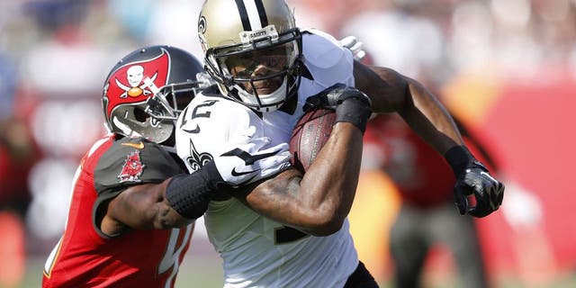 TAMPA, FL - DECEMBER 28: Marques Colston #12 of the New Orleans Saints runs upfield for extra yardage after a reception against the Tampa Bay Buccaneers during the first half of the game at Raymond James Stadium on December 28, 2014 in Tampa, Florida. (Photo by Joe Robbins/Getty Images)
