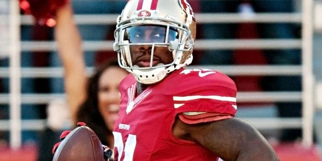 Dec 28, 2014; Santa Clara, CA, USA; San Francisco 49ers wide receiver Anquan Boldin (81) looks over his shoulder while scoring a touchdown during the first quarter against the Arizona Cardinals at Levi's Stadium. Mandatory Credit: Ed Szczepanski-USA TODAY Sports