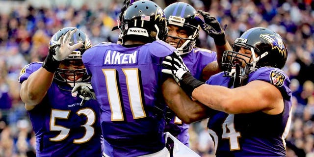 BALTIMORE, MD - DECEMBER 28: Wide receiver Kamar Aiken #11 of the Baltimore Ravens celebrates with teammates after catching a fourth quarter touchdown against the Cleveland Browns at M&T Bank Stadium on December 28, 2014 in Baltimore, Maryland. (Photo by Rob Carr/Getty Images)