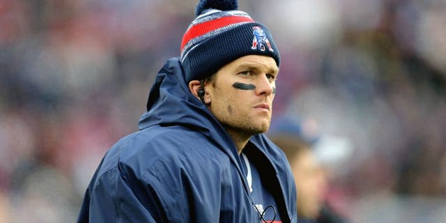 FOXBORO, MA - DECEMBER 28: Tom Brady #12 of the New England Patriots looks on during the fourth quarter against the Buffalo Bills at Gillette Stadium on December 28, 2014 in Foxboro, Massachusetts. (Photo by Jim Rogash/Getty Images)