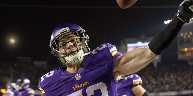 Dec 27, 2015; Minneapolis, MN, USA; Minnesota Vikings safety Harrison Smith (22) celebrates his interception for a touchdown during the second quarter against the New York Giants at TCF Bank Stadium. Mandatory Credit: Brace Hemmelgarn-USA TODAY Sports