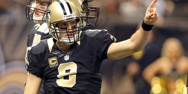 Dec 27, 2015; New Orleans, LA, USA; New Orleans Saints quarterback Drew Brees (9) gestures during the first quarter of their game against the Jacksonville Jaguars at the Mercedes-Benz Superdome. Mandatory Credit: Chuck Cook-USA TODAY Sports