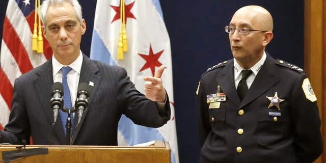 FILE - In this Dec. 7, 2015 file photo, Chicago Mayor Rahm Emanuel, accompanied by Interim Chicago Police Superintendent John Escalante, speaks during a news conference in Chicago.