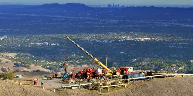 FILE- This Nov. 3, 2015, file photo provided by Southern California Gas Co., shows equipment being used as SoCalGas crews and technical experts attempt to safely stop the flow of natural gas leaking from a storage well at the utility’s Aliso Canyon facility near Northridge section of Los Angeles.