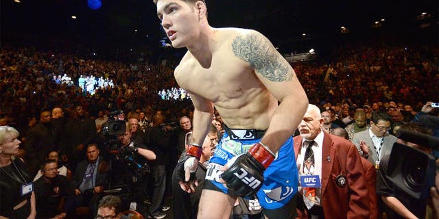 LAS VEGAS, NV - DECEMBER 28: Chris Weidman enters the Octagon to face Anderson Silva in their UFC middleweight championship bout during the UFC 168 event at the MGM Grand Garden Arena on December 28, 2013 in Las Vegas, Nevada. (Photo by Donald Miralle/Zuffa LLC/Zuffa LLC via Getty Images)
