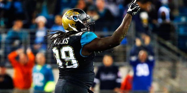 JACKSONVILLE, FL - DECEMBER 18: Sen'Derrick Marks #99 of the Jacksonville Jaguars celebrates a sack in the fourth quarter against the Tennessee Titans at EverBank Field on December 18, 2014 in Jacksonville, Florida. (Photo by Sam Greenwood/Getty Images)