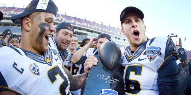 FORT WORTH, TX - DECEMBER 29: Daniel Lasco #2 of the California Golden Bears and Jared Goff #16 of the California Golden Bears celebrate with the championship trophy after beating the Air Force Falcons 55-36 in the Lockheed Martin Armed Forces Bowl at Amon G. Carter Stadium on December 29, 2015 in Fort Worth, Texas. (Photo by Tom Pennington/Getty Images)