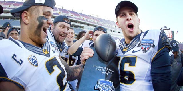 FORT WORTH, TX - DECEMBER 29: Daniel Lasco #2 of the California Golden Bears and Jared Goff #16 of the California Golden Bears celebrate with the championship trophy after beating the Air Force Falcons 55-36 in the Lockheed Martin Armed Forces Bowl at Amon G. Carter Stadium on December 29, 2015 in Fort Worth, Texas. (Photo by Tom Pennington/Getty Images)